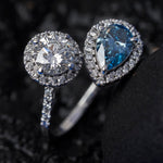 round and pear cut blue diamond ring