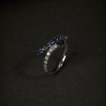 dark blue sapphire and diamond snake shaped ring