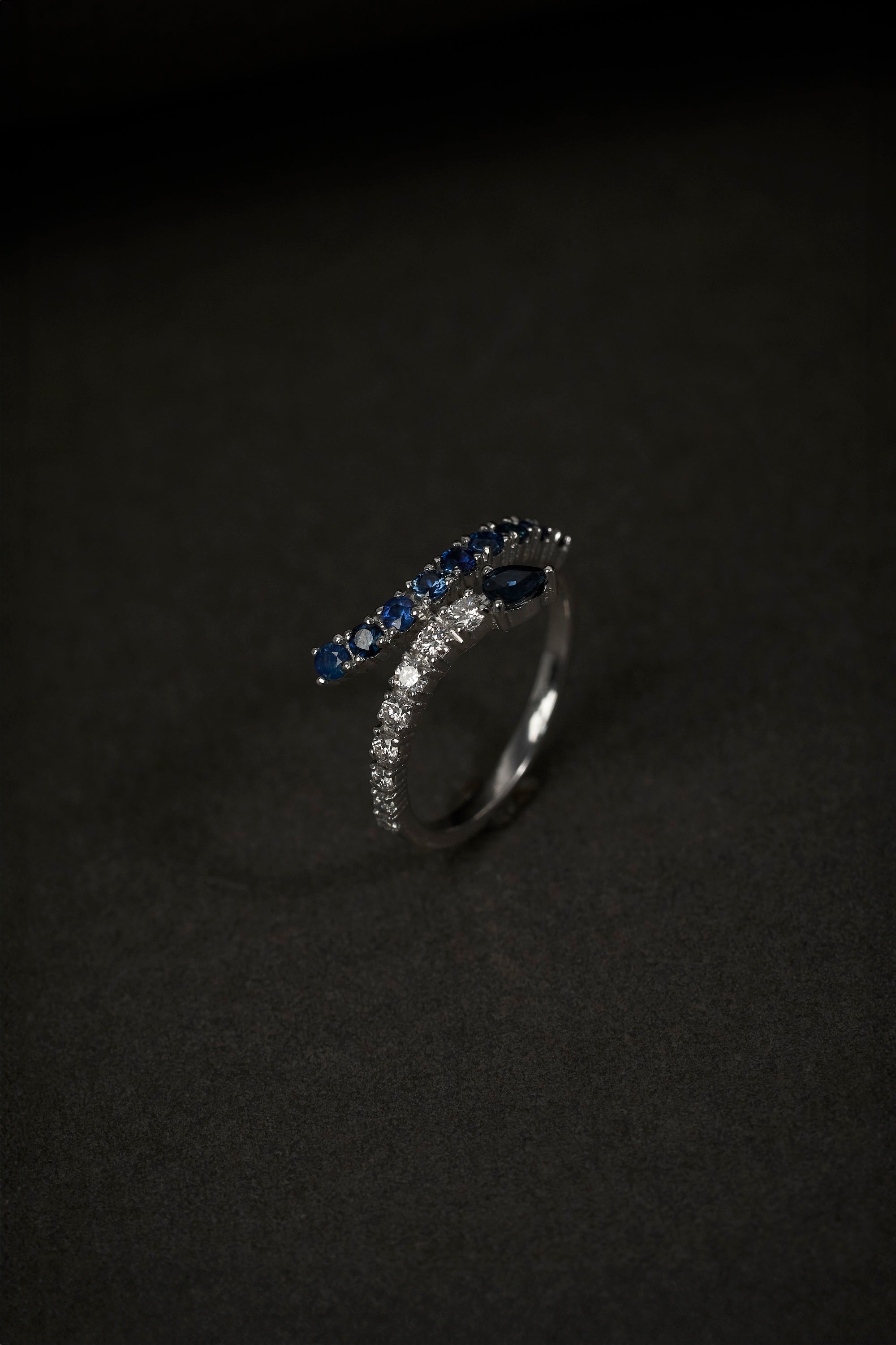 dark blue sapphire and diamond snake shaped ring