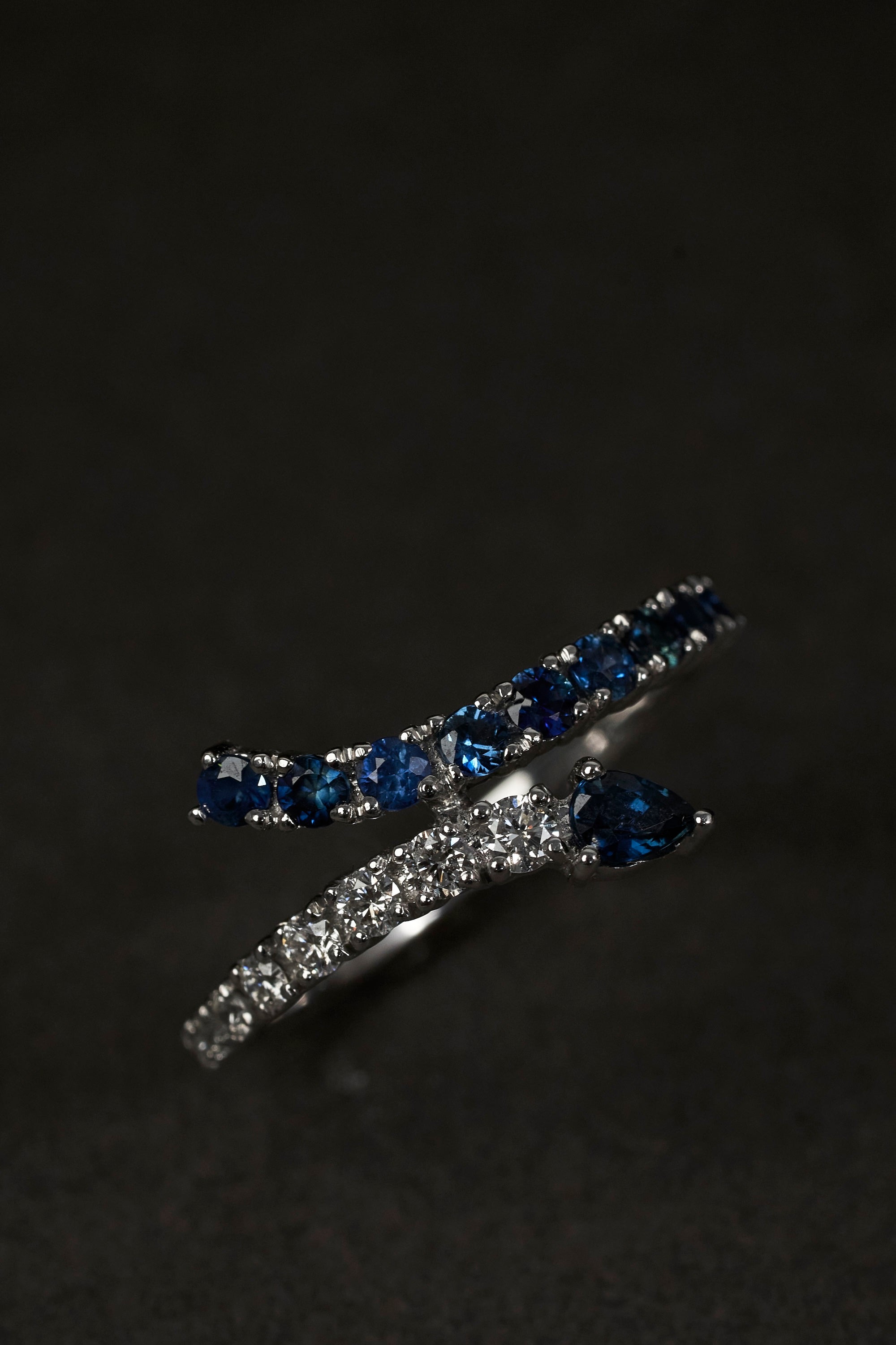 dark blue sapphire and diamond snake shaped ring