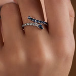 dark blue sapphire and diamond snake shaped ring