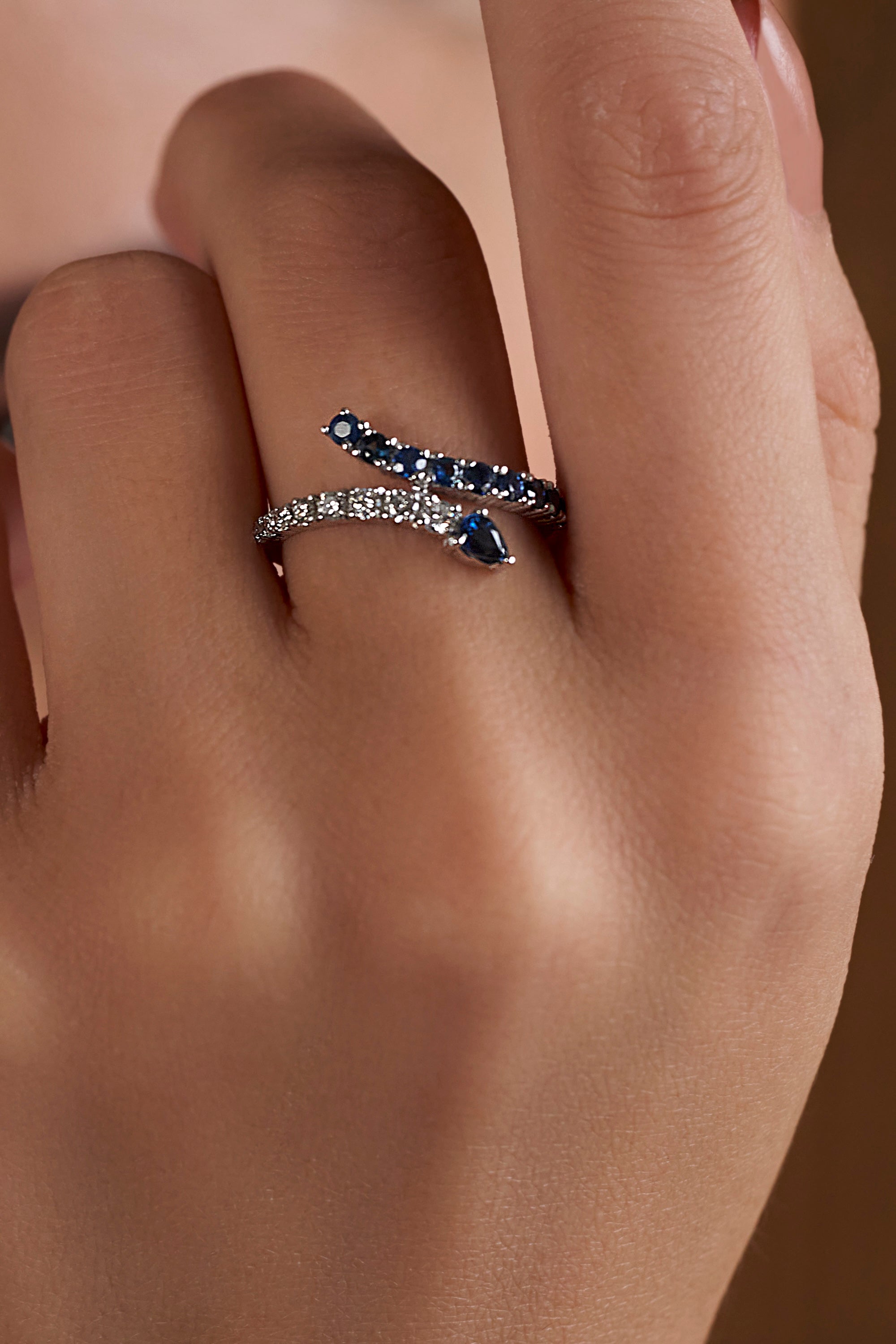 dark blue sapphire and diamond snake shaped ring