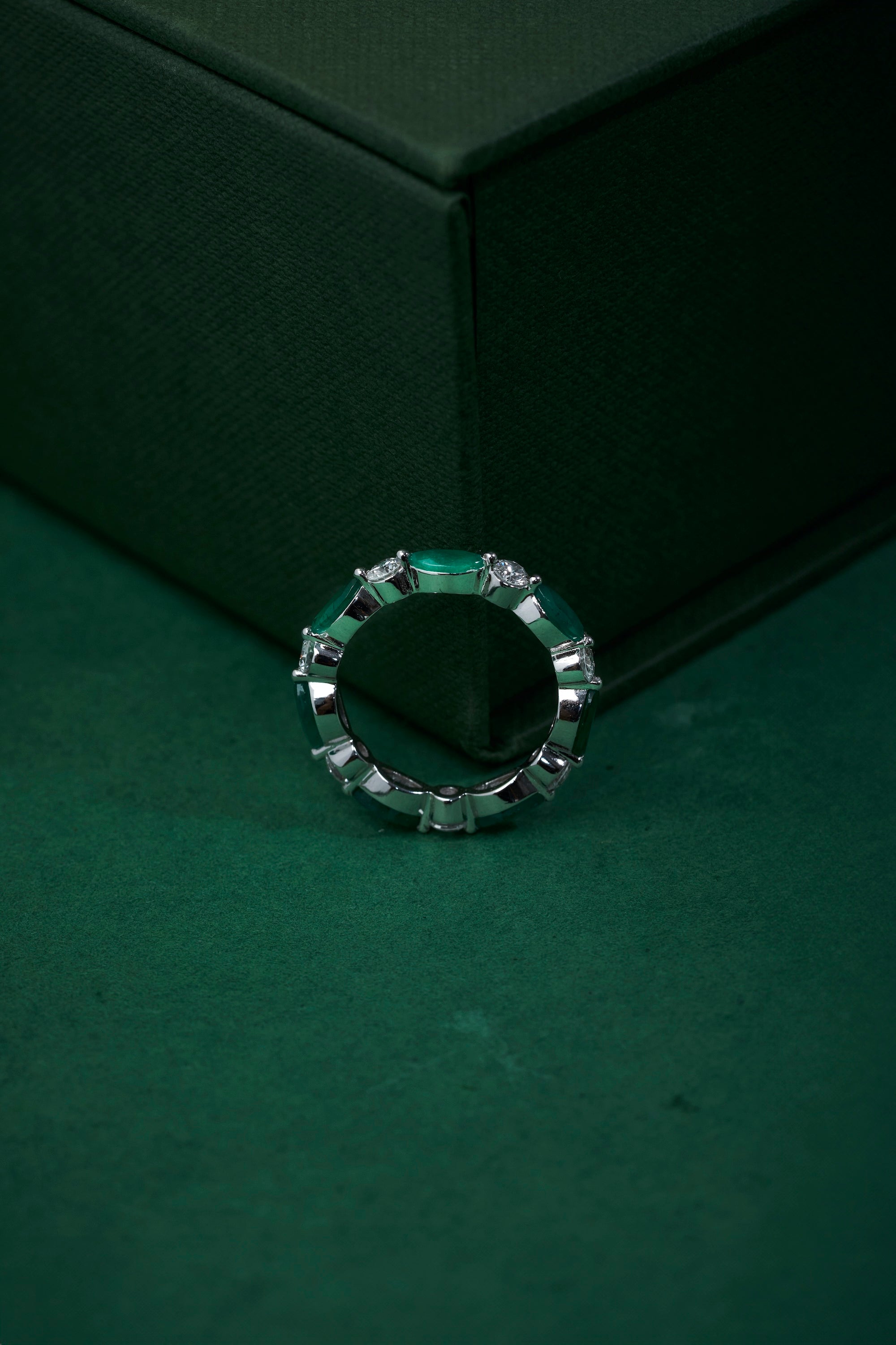 Marquise shaped diamond and emerald band